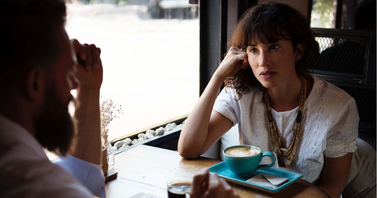 couple talking at coffee shop