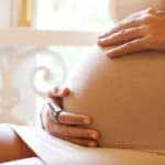 woman holding pregnant belly