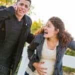 pregnant couple panicking because water just broke in park