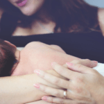 new mom breastfeeding baby in diaper