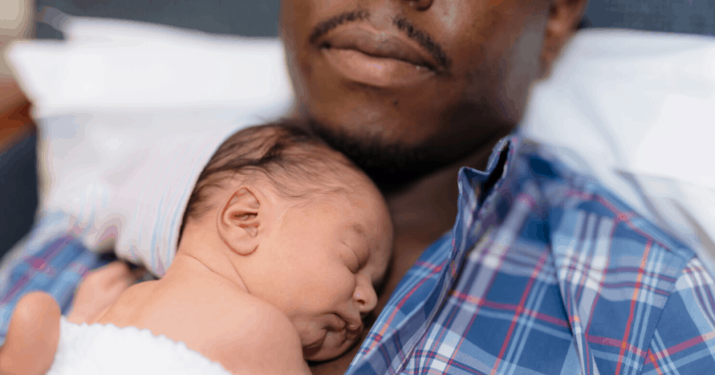 partner father with newborn baby caring