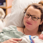 new mom caring for baby after cesarean birth