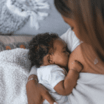 newborn baby breastfeeding at home