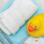 rubber teck and washcloths ready to bathe baby