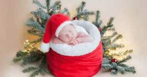 Surviving the holidays with a newborn, newborn baby in a Santa hat