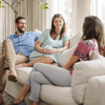 Tampa Birth Doula Meeting with a Pregnant Couple sitting on a couch