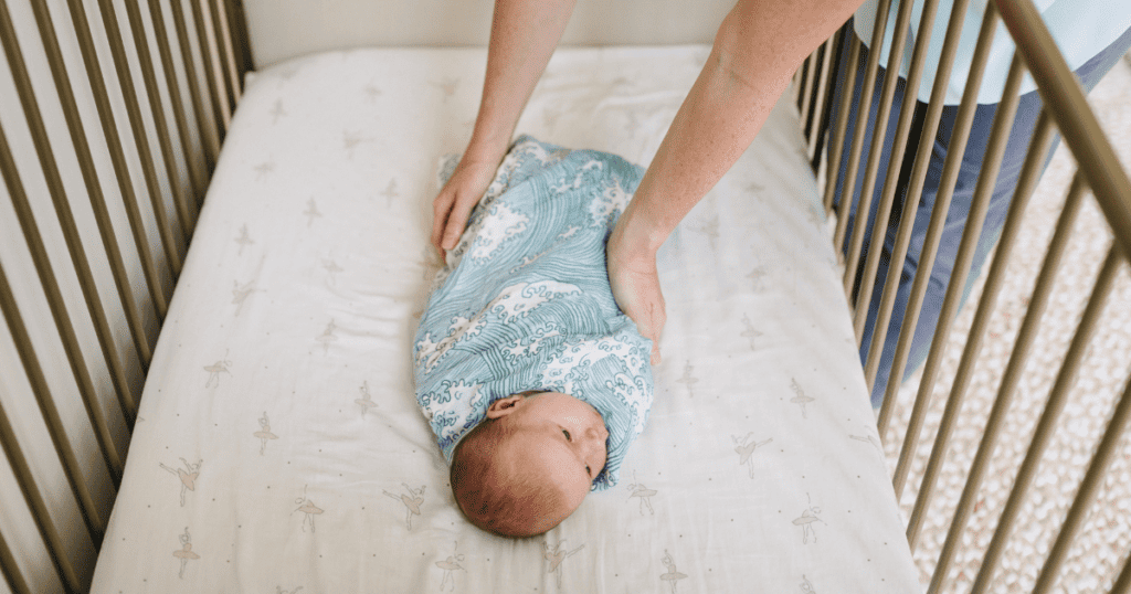 Safe Sleep For Baby with baby swaddled in crib