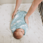 Safe Sleep For Baby with baby swaddled in crib