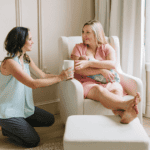 Tampa doula Christie Rinder offering a cup of tea to a new mom