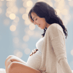 Pregnant Mom looking at belly