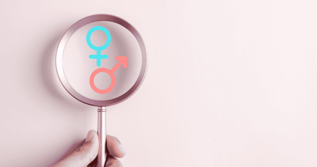 magnifying glass looking at boy or girl symbols