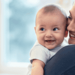 Mom and baby smiling
