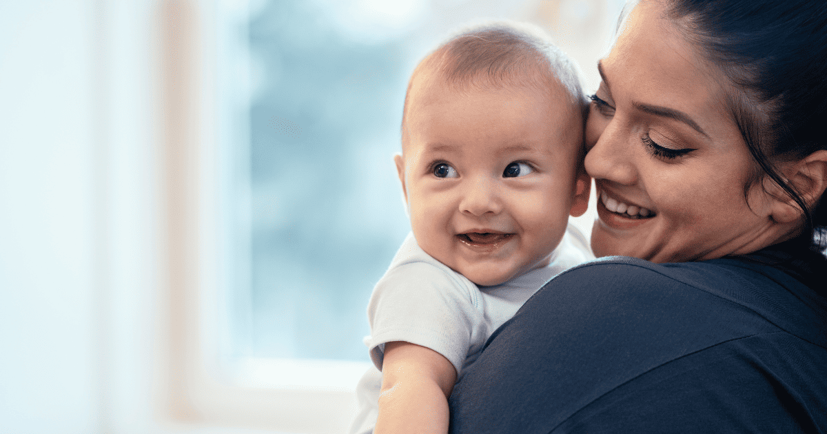 Mom and baby smiling