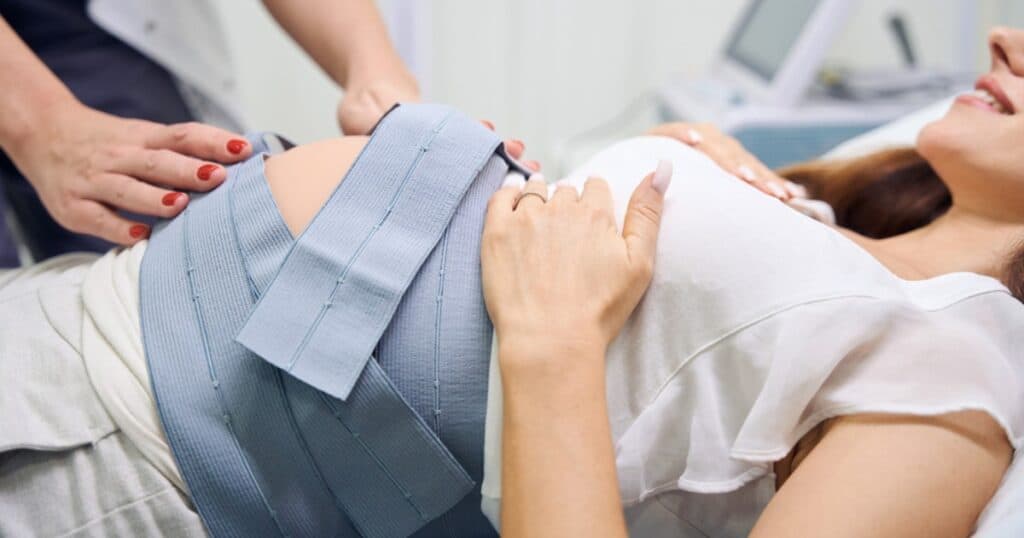 Pregnant Mom with monitors on her belly for a non-stress test