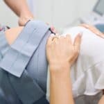 Pregnant Mom with monitors on her belly for a non-stress test