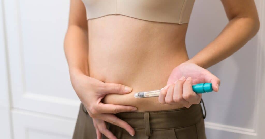woman injecting her belly