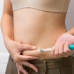 woman injecting her belly