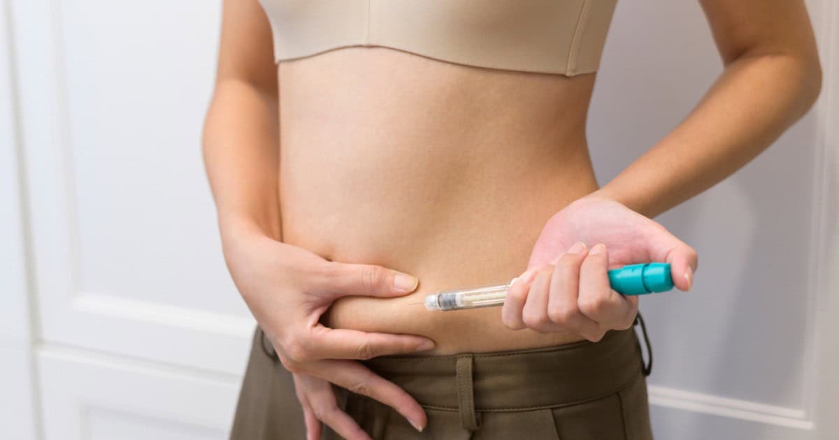woman injecting her belly