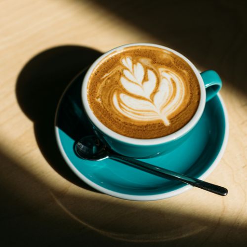 coffee in blue cup on table