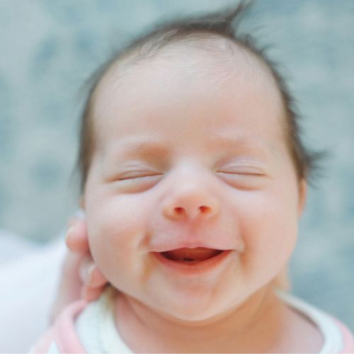happy full baby after a feed