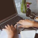 woman searching the internet on laptop