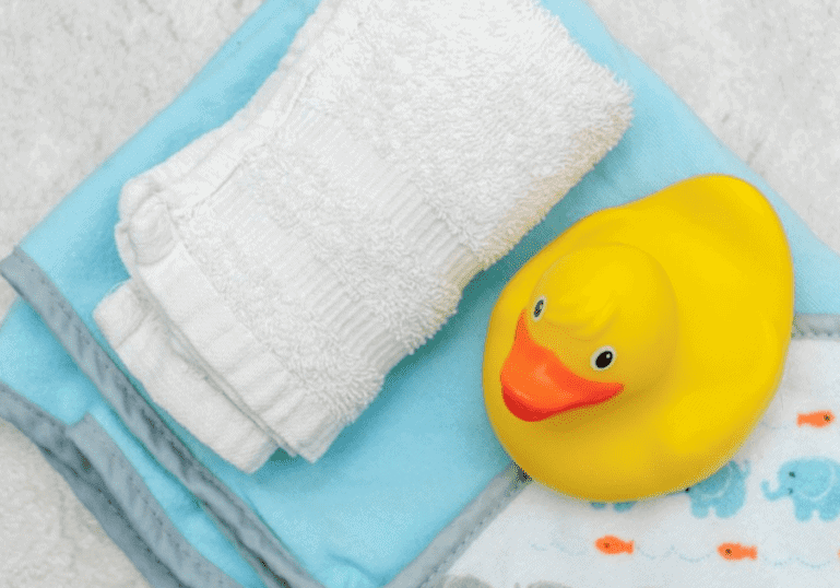 rubber teck and washcloths ready to bathe baby