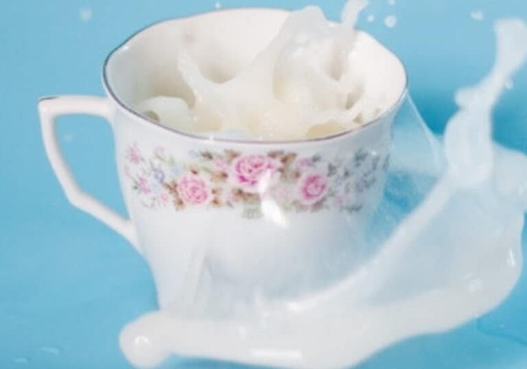 milk overflowing in teacup