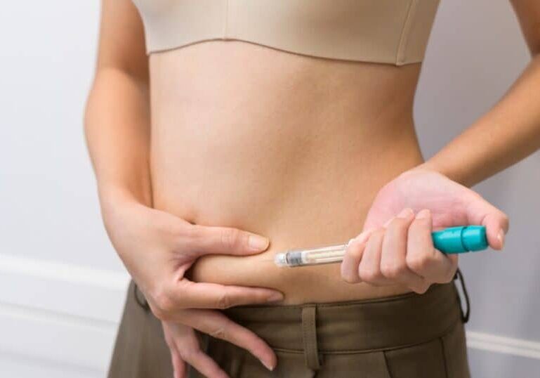 woman injecting her belly