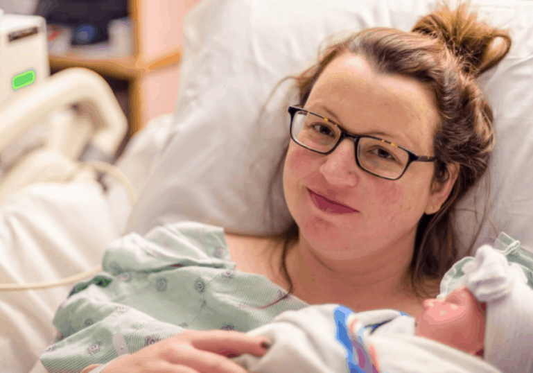 new mom caring for baby after cesarean birth