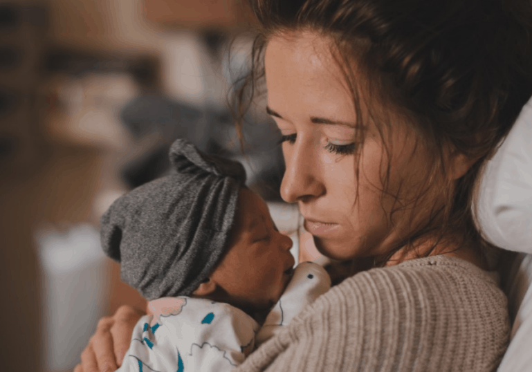 new mom holding baby