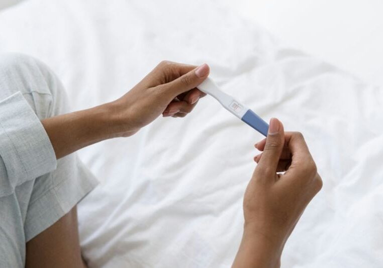 Holding a pregnancy test