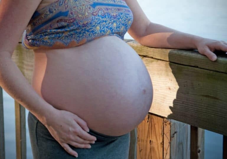 pregnant woman by water