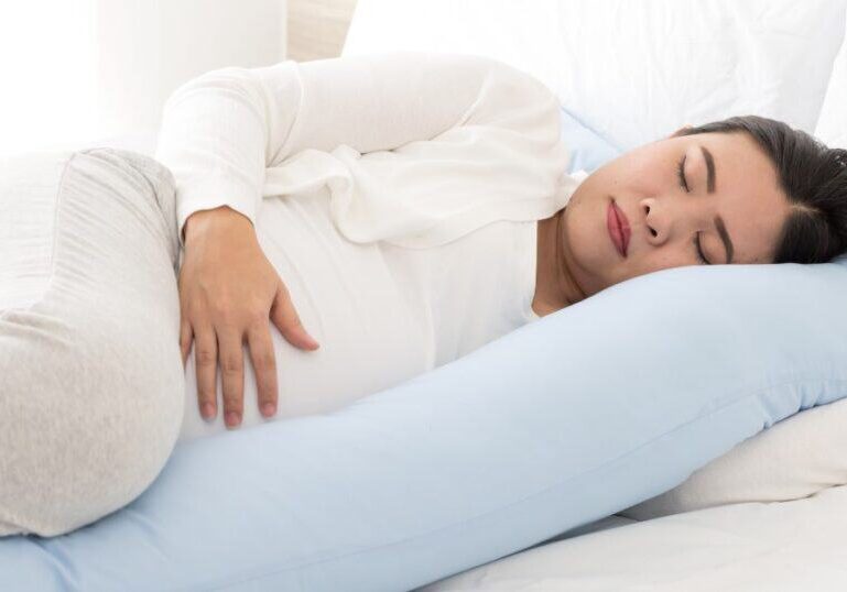 Pregnant Mom side-lying in bed