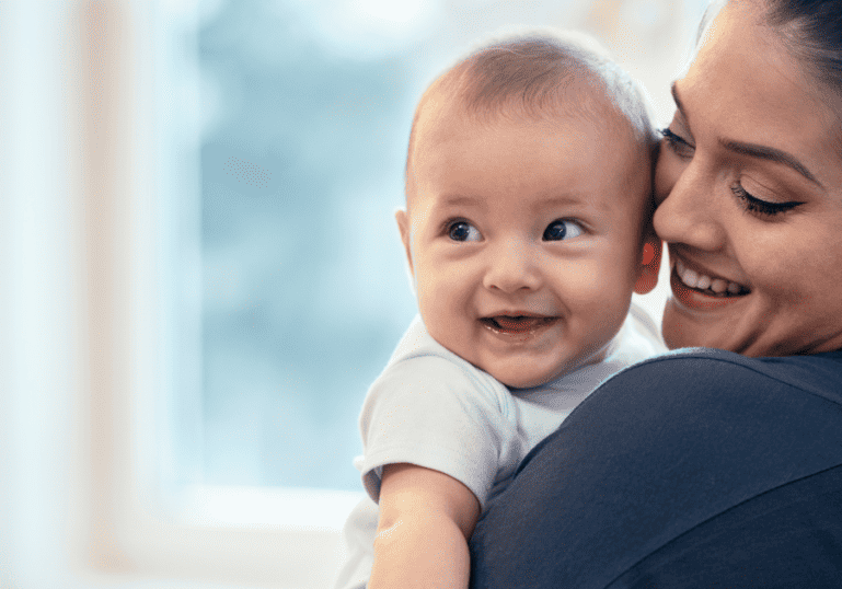 Mom and baby smiling