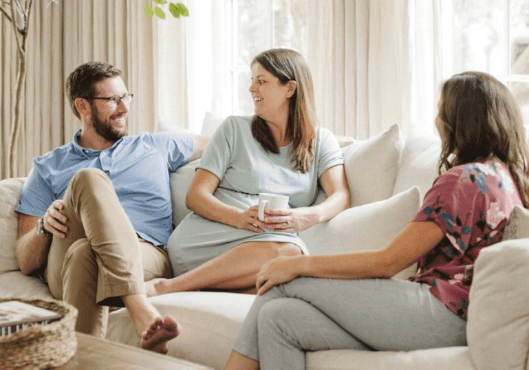 Birth Doula Christie Rinder at prenatal home visit with pregnant couple in Tampa FL