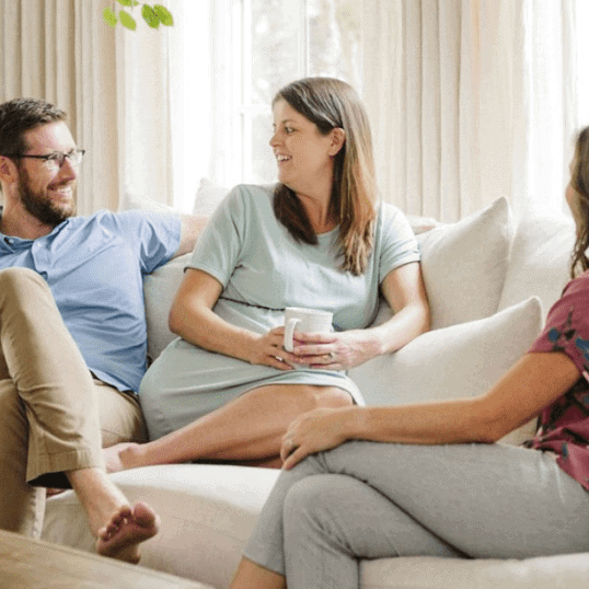 Birth Doula Christie Rinder at prenatal home visit with pregnant couple in Tampa FL