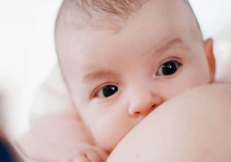 infant breastfeeding close-up