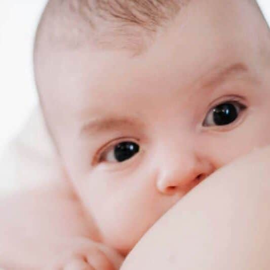 infant breastfeeding close-up