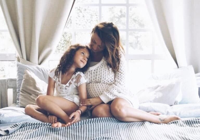 mom preparing older sibling for baby