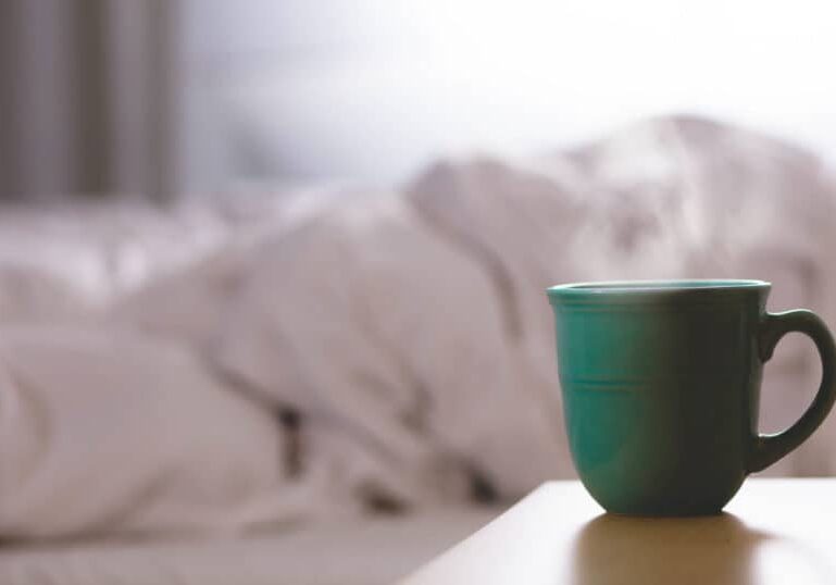 cup of hot tea by bedside