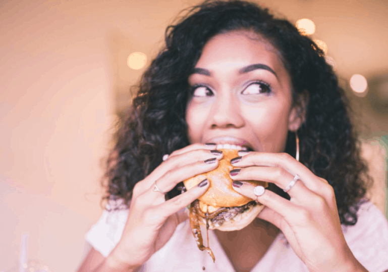 hungry mom eating burger